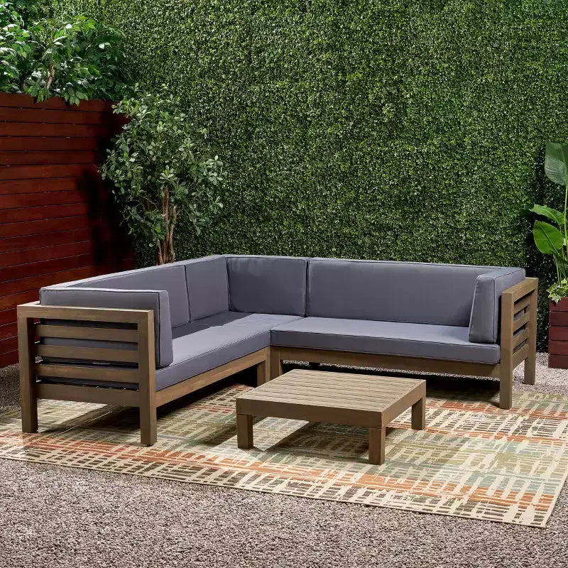 Christopher Knight Home Cynthia Ensemble de canapés de jardin modulables en L en bois d'acacia rembourrés à 5 places avec table basse